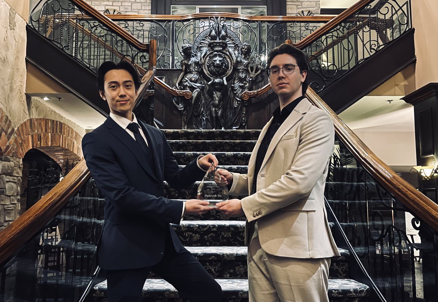 Ethan Chiang and Ivan Litviakov holding the President of the Year award, 2026